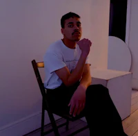 a man sitting on a chair in a room